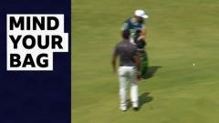 Berger’s huge tee shot catches the group ahead